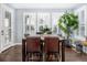 Bright dining room with a large window, wooden floors, and a dining table at 3385 Birch Rd, Longmont, CO 80504