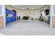 Neat garage with storage, workspace, and epoxy flooring, offering both functionality and style at 3385 Birch Rd, Longmont, CO 80504