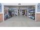 Open garage with storage racks and ample space for parking and organizing equipment and supplies at 3385 Birch Rd, Longmont, CO 80504