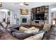 Comfortable living room featuring a fireplace, built-in shelves, and plush leather seating at 3385 Birch Rd, Longmont, CO 80504