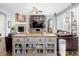 Comfortable living room with a fireplace, custom built-ins, and hardwood floors at 3385 Birch Rd, Longmont, CO 80504