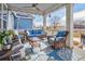 Inviting covered porch featuring comfortable seating and views of the surrounding landscape at 3385 Birch Rd, Longmont, CO 80504