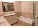 This bathroom offers a soaking tub and vanity with beautiful finishes at 8659 E Kenyon Ave, Denver, CO 80237