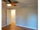 Empty bedroom with hardwood floors, an overhead fan, and a closet at 8659 E Kenyon Ave, Denver, CO 80237