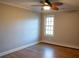 Bedroom with hardwood floors, ceiling fan and a window to the outside at 8659 E Kenyon Ave, Denver, CO 80237