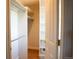 View into this walk-in closet with custom shelving at 8659 E Kenyon Ave, Denver, CO 80237