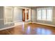 Spacious living area with hardwood floors, trimmed walls, and ample natural light at 8659 E Kenyon Ave, Denver, CO 80237