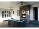 Covered patio with outdoor seating and a stone fireplace at 8659 E Kenyon Ave, Denver, CO 80237