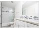 Clean bathroom with granite countertop and tiled shower at 335 Josephine St # A, Denver, CO 80206