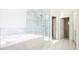 Large bathroom with a double vanity and a walk-in shower at 335 Josephine St # A, Denver, CO 80206