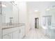 Bright bathroom with double vanity and a large mirror at 335 Josephine St # A, Denver, CO 80206