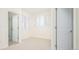 Bright bedroom with window shutters and access to bathroom at 335 Josephine St # A, Denver, CO 80206