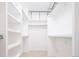 Spacious walk-in closet with built-in shelves and hanging rods at 335 Josephine St # A, Denver, CO 80206