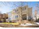 Beige two-story home with large windows and a manicured lawn at 335 Josephine St # A, Denver, CO 80206