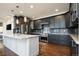 Modern kitchen with dark gray cabinets, granite countertops and stainless steel appliances at 335 Josephine St # A, Denver, CO 80206