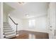 Bright and airy living room with hardwood floors, staircase, and natural light at 335 Josephine St # A, Denver, CO 80206