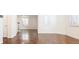 Open living room with hardwood floors and white walls at 335 Josephine St # A, Denver, CO 80206