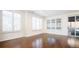 Bright living room with hardwood floors and plantation shutters at 335 Josephine St # A, Denver, CO 80206