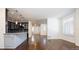Open concept living room and kitchen with hardwood floors at 335 Josephine St # A, Denver, CO 80206