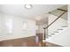 Elegant living room with hardwood floors, staircase, and chandelier at 335 Josephine St # A, Denver, CO 80206