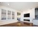 Living room with hardwood floors, fireplace, and patio access at 335 Josephine St # A, Denver, CO 80206
