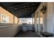 Outdoor patio with built-in grill, covered seating area, and views of trees at 335 Josephine St # A, Denver, CO 80206