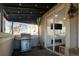 Covered patio features a grill, fireplace, and access to the interior at 335 Josephine St # A, Denver, CO 80206