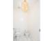 Powder room with toilet, bidet, and chandelier at 335 Josephine St # A, Denver, CO 80206