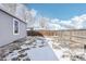 Backyard featuring a tall wooden fence and a small gardening bed at 262 Apache Pl, Brighton, CO 80603