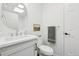 Clean half bathroom with a vessel sink, modern fixtures, and crisp white walls at 262 Apache Pl, Brighton, CO 80603