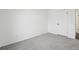 Neutral bedroom featuring light gray carpet and a white door at 262 Apache Pl, Brighton, CO 80603