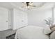 Bright bedroom featuring a tray ceiling, ceiling fan, and plush carpeting at 262 Apache Pl, Brighton, CO 80603