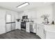 Well-lit kitchen featuring stainless steel appliances, a sink, and sleek countertops at 262 Apache Pl, Brighton, CO 80603