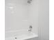 Bright and clean shower with a chrome shower head and faucet at 262 Apache Pl, Brighton, CO 80603