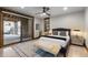 Bedroom featuring sliding glass doors, wood accents, and a decorative rug at 8246 Raphael Ln, Littleton, CO 80125