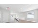 Bright hallway features a modern design, neutral colors, and natural light from the window at 1312 Sienna Peak Cir, Erie, CO 80516