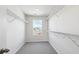 Large walk-in closet with metal shelving and natural light from a window at 1312 Sienna Peak Cir, Erie, CO 80516