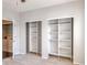 Bedroom with closet and view into the laundry room at 14251 E 1St Dr # 308, Aurora, CO 80011