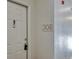 Close-up shot of a Ring doorbell system on apartment 308's white door with silver hardware at 14251 E 1St Dr # 308, Aurora, CO 80011