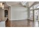Spacious living room with high ceilings, modern lighting, and access to a private balcony at 14251 E 1St Dr # 308, Aurora, CO 80011