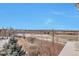 An expansive view from the property showcasing a highway, cityscape, and snow-capped mountains at 14251 E 1St Dr # 308, Aurora, CO 80011
