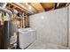 Bright basement with a water heater and a modern washer and dryer set at 5625 W 109Th Cir, Westminster, CO 80020