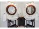 This bathroom features dual sinks, round mirrors, and white walls at 5625 W 109Th Cir, Westminster, CO 80020
