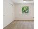 Bedroom with a large window, neutral walls, carpet flooring, and a closet at 5625 W 109Th Cir, Westminster, CO 80020