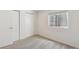 Bedroom featuring carpet flooring, neutral walls, a window, and closet at 5625 W 109Th Cir, Westminster, CO 80020