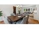 Elegant dining room with chandelier and seating for six adjoins the inviting living room at 5625 W 109Th Cir, Westminster, CO 80020
