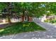 Inviting home exterior with mature trees and a well-manicured lawn creating curb appeal at 5625 W 109Th Cir, Westminster, CO 80020