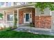 Welcoming front porch with brick accents and ample natural light creates a cozy entry at 5625 W 109Th Cir, Westminster, CO 80020
