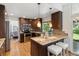 Stylish kitchen with stainless steel appliances, granite counters, and hardwood floors at 5625 W 109Th Cir, Westminster, CO 80020
