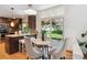Kitchen nook featuring stainless appliances, granite counters, and a glass door to the backyard at 5625 W 109Th Cir, Westminster, CO 80020